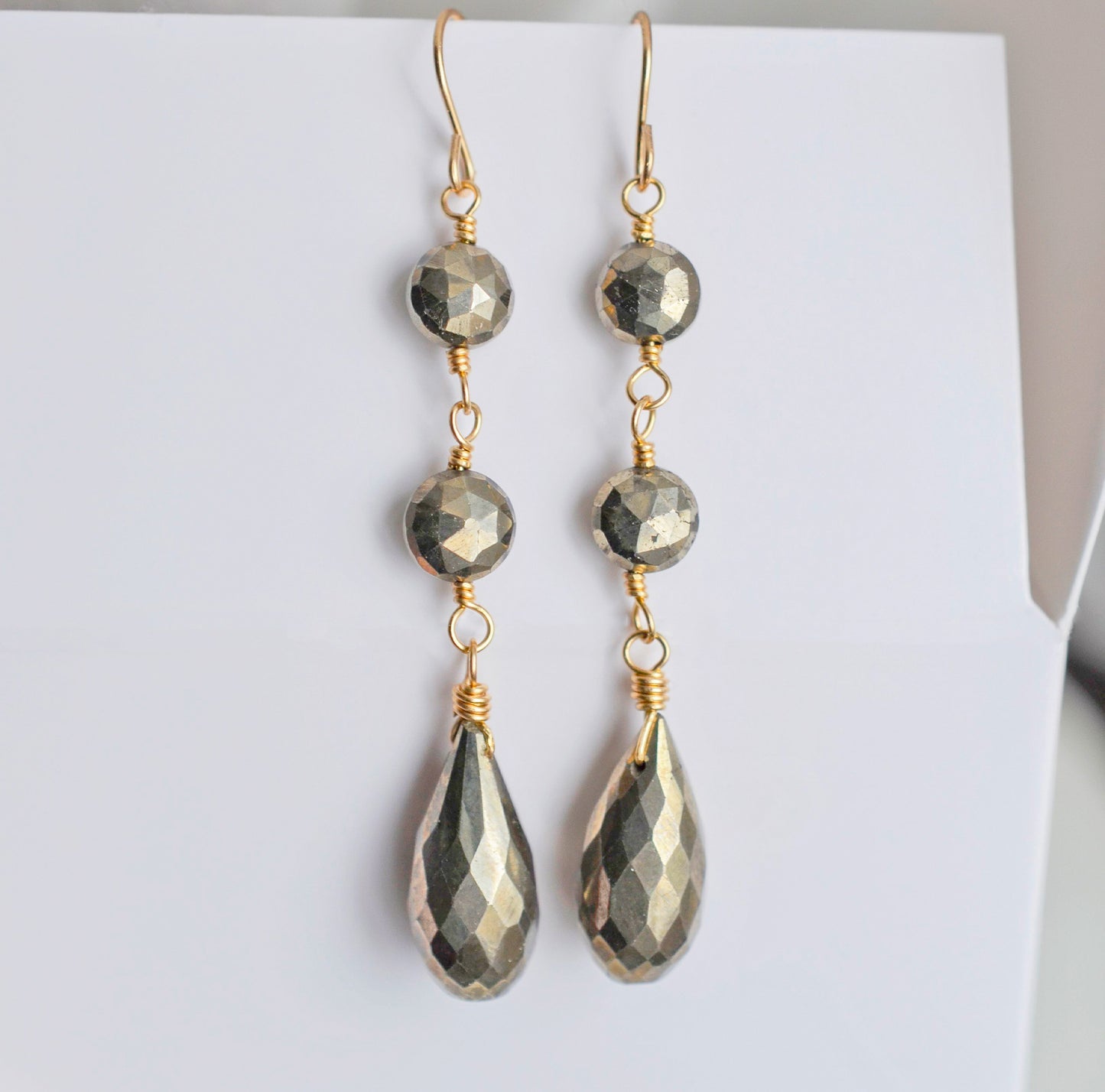 Long, handmade pyrite dangle earrings in 14k gold filled.