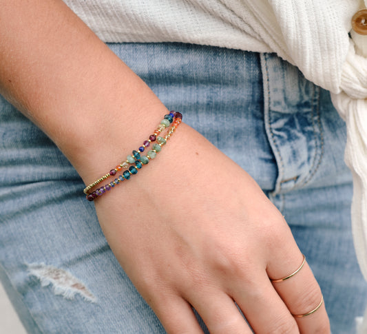 Handmade real gemstone bracelet for the Chakras or Pride. Stones include: Garnet, amethyst, topaz, emerald, carnelian, CZ, and tanzanite.