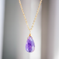 Purple amethyst teardrop pendant on a 14k gold chain. Dainty handmade crystal jewelry.