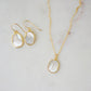 A matching set of mother of pearl earrings and necklace shown in gold. Handmade in Connecticut by Gemnia.