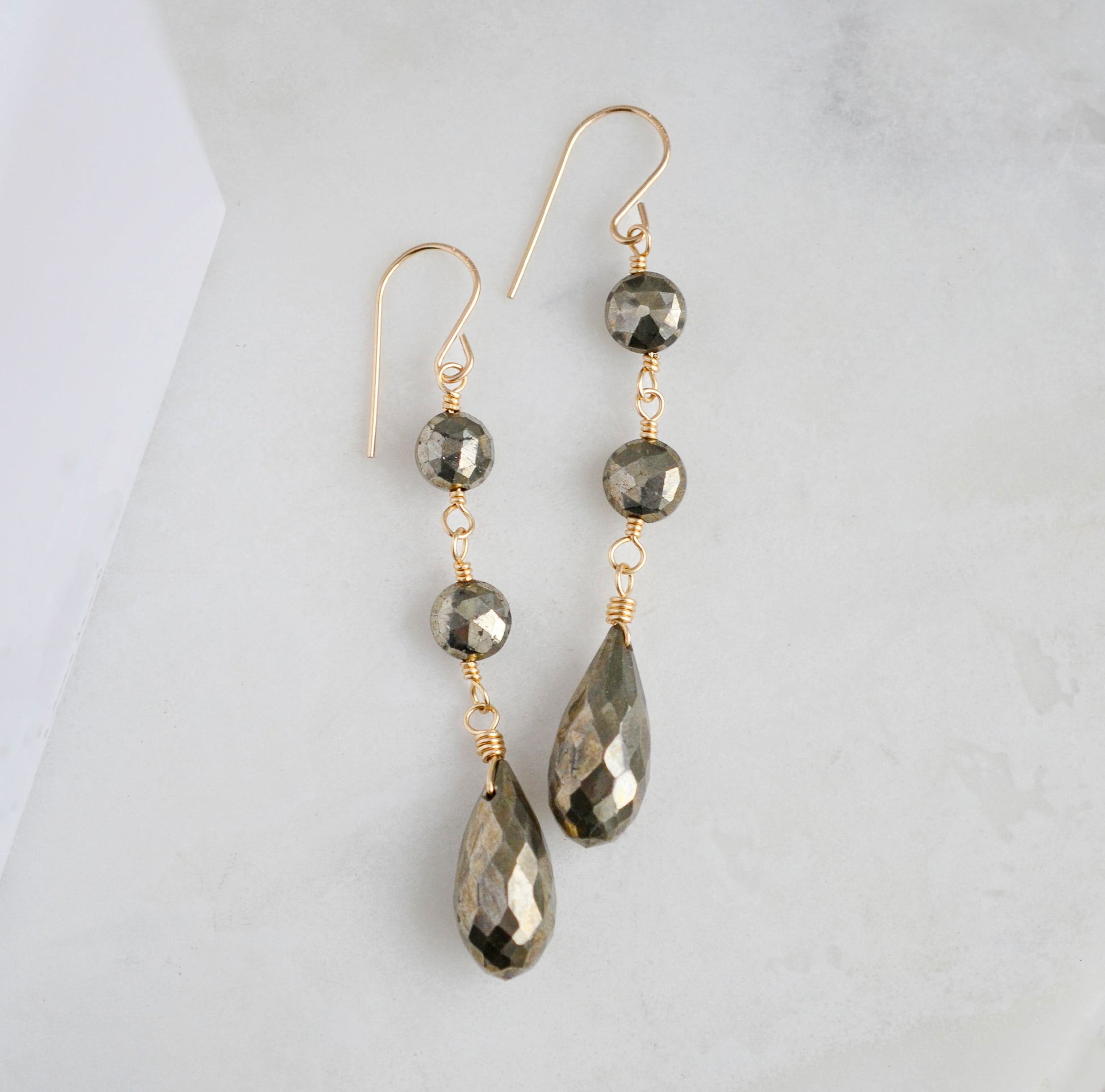 Handmade natural pyrite fools gold long dangle earrings in gold. 