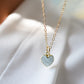 Pale blue natural aquamarine gemstone heart pendant set on a 14k gold filled chain. The stone is genuine and faceted with a 22k gold electroplate bezel.