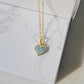 Pale blue natural aquamarine gemstone heart pendant set on a 14k gold filled chain. The stone is genuine and faceted with a 18k gold electroplate bezel.