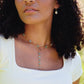 Modeled images. Pearl, aquamarine, and sunstone necklaces layered together.