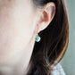 Genuine, natural blue turquoise faceted hearts set on 14k gold filled earring hooks. The stones range in blue and green, with some containing white or brown.