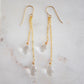 Long clear crystal quartz earrings with two teardrop dangles hanging from a dainty 14k gold filled chain.
