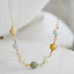 A multi-color burma jade necklace featuring seven round green, brown, yellow, or blue natural stones. Handmade in Connecticut by Gemnia Jewelry.