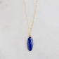 A handmade natural genuine blue lapis lazuli gemstone pendant on a dainty 14k gold filled chain. This necklace is made in Connecticut by Gemnia Jewelry.
