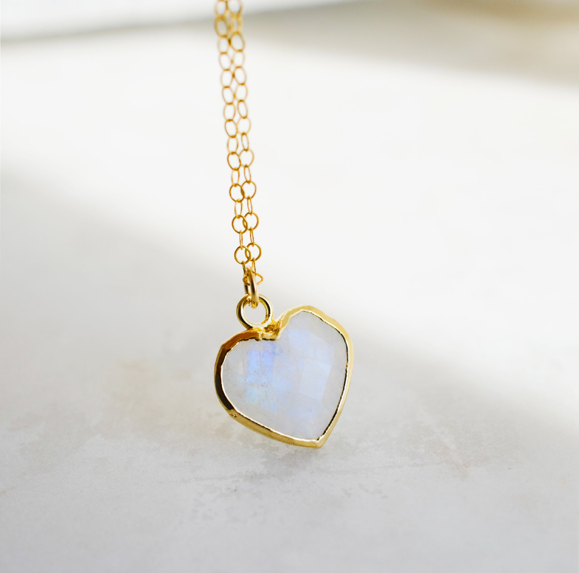 Natural handmade rainbow moonstone heart-shaped pendant necklace with 14k gold filled chain. Handmade in New England by Gemnia Jewelry. 