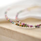 Close up of Tourmaline stones. Colors include: pink, green, brown, and clear.