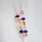 Mismatched gemstone long bar earrings shown in sterling silver. Stones include: amethyst, aquamarine, fluorite, and sunstone. Stones are set onto a long straight bar.