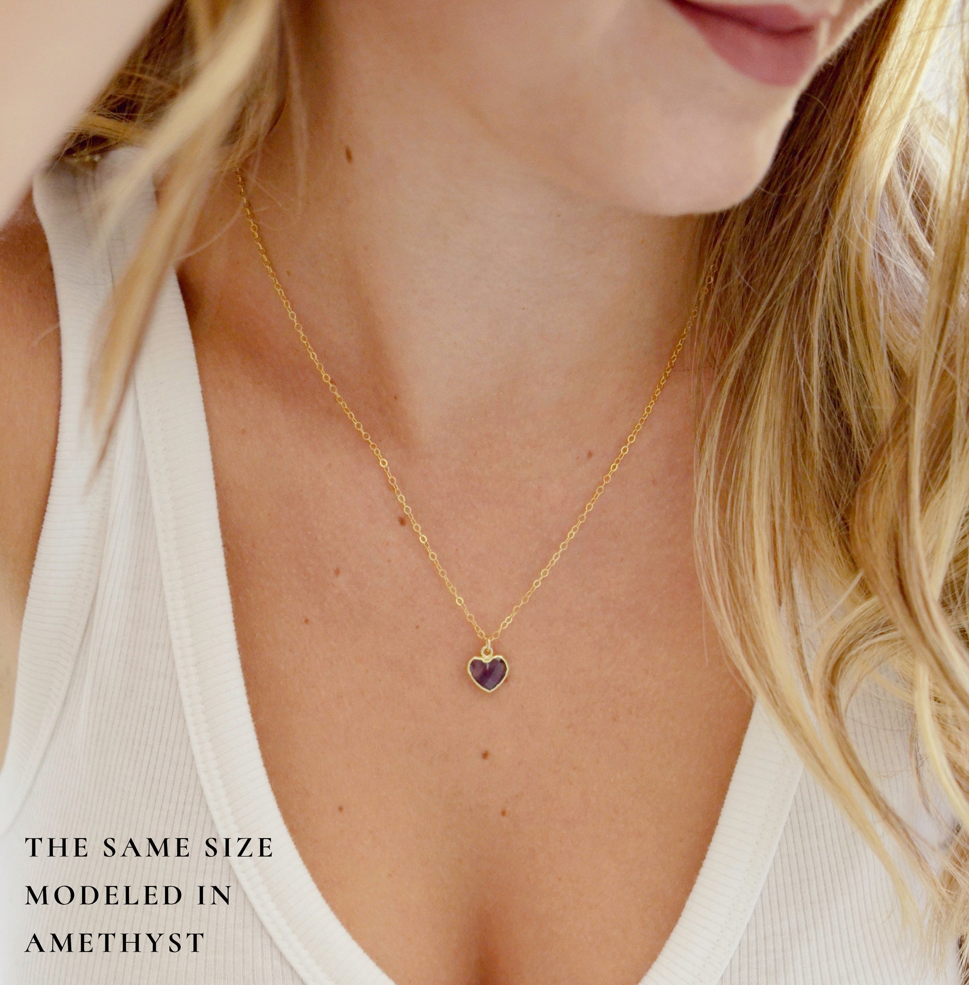 Pale blue natural aquamarine gemstone heart pendant set on a 14k gold filled chain. The stone is genuine and faceted with a 22k gold electroplate bezel.