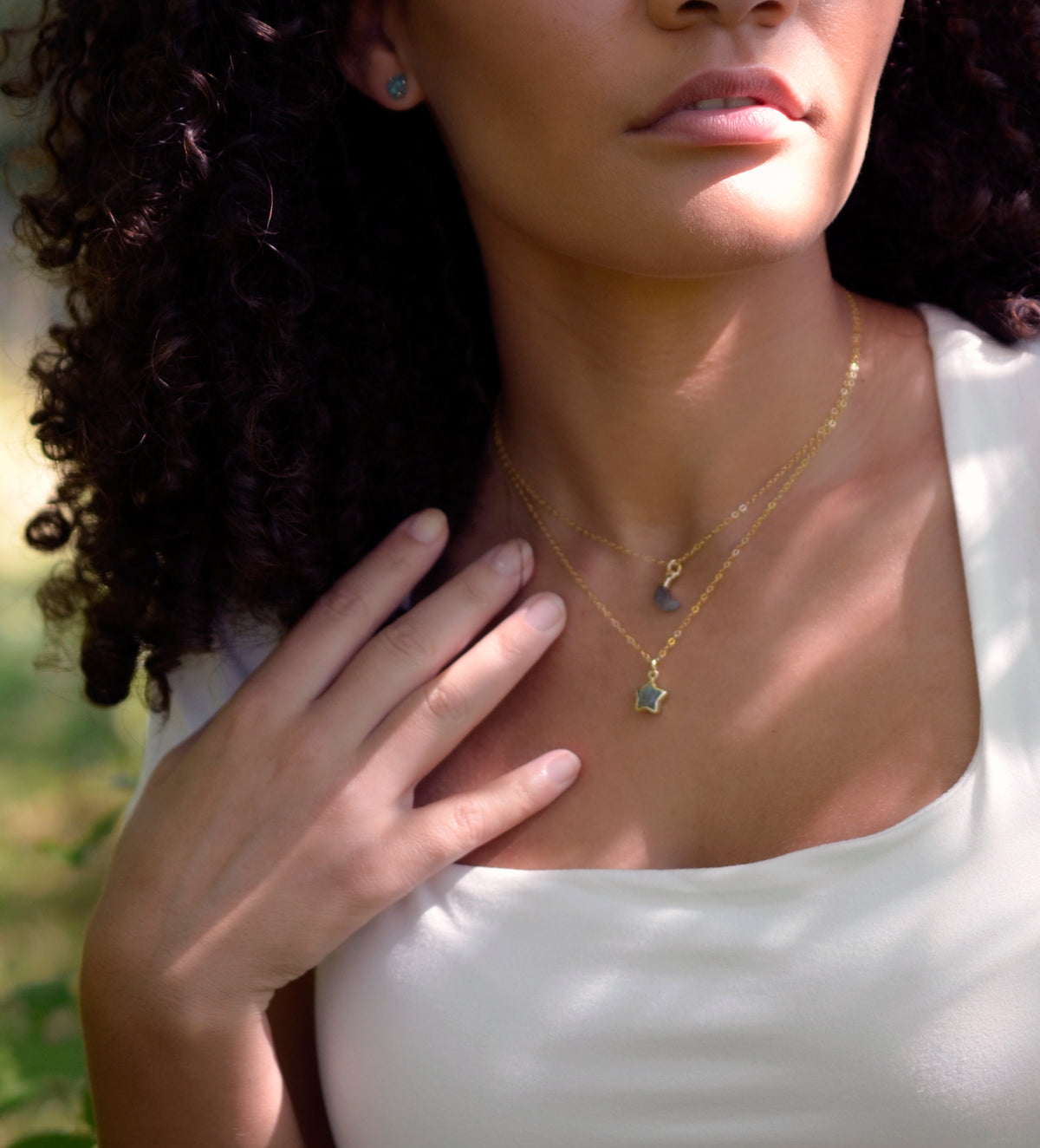 Layered natural Labradorite gemstone star and moon pendants modeled on 14k gold filled chains. Handmade jewelry by Gemnia.
