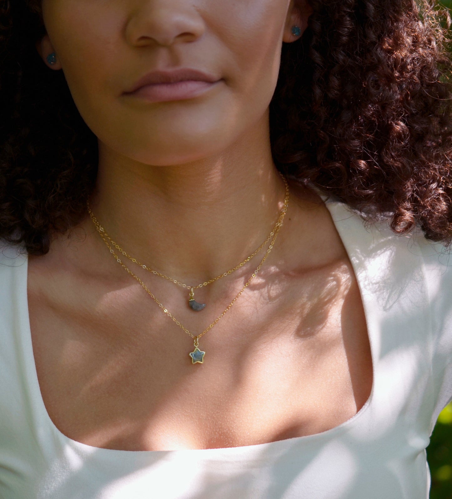 Labradorite star necklace layered with a Labradorite moon necklace. 