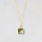 A natural silver colored mother of pearl square shaped pendant set on a 14k gold filled chain. This necklace is handmade in Connecticut by Gemnia.