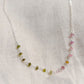 Close up of multi-color Tourmaline chain necklace. Each stone is a different color. Shown in sterling silver.