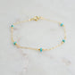 A turquoise and gold filled bracelet with a chain-link design, featuring a gold filled band and turquoise stones. Handmade in Connecticut by Gemnia Jewelry.