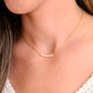 Modeled image of white freshwater pearl bar necklace shown in 14k gold filled. The peals are small and slightly irregular in shape.