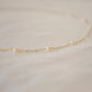 Genuine white freshwater pearls set onto a 14k gold filled chain. 