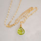 Natural green Peridot faceted teardrop suspended from a 14k gold filled cable chain.
