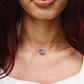 Raw blue lapis lazuli stone suspended from a gold chain. Modeled Image.