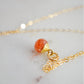 Natural orange Sunstone necklace. The stone is a faceted round and set onto a 14k gold filled chain.