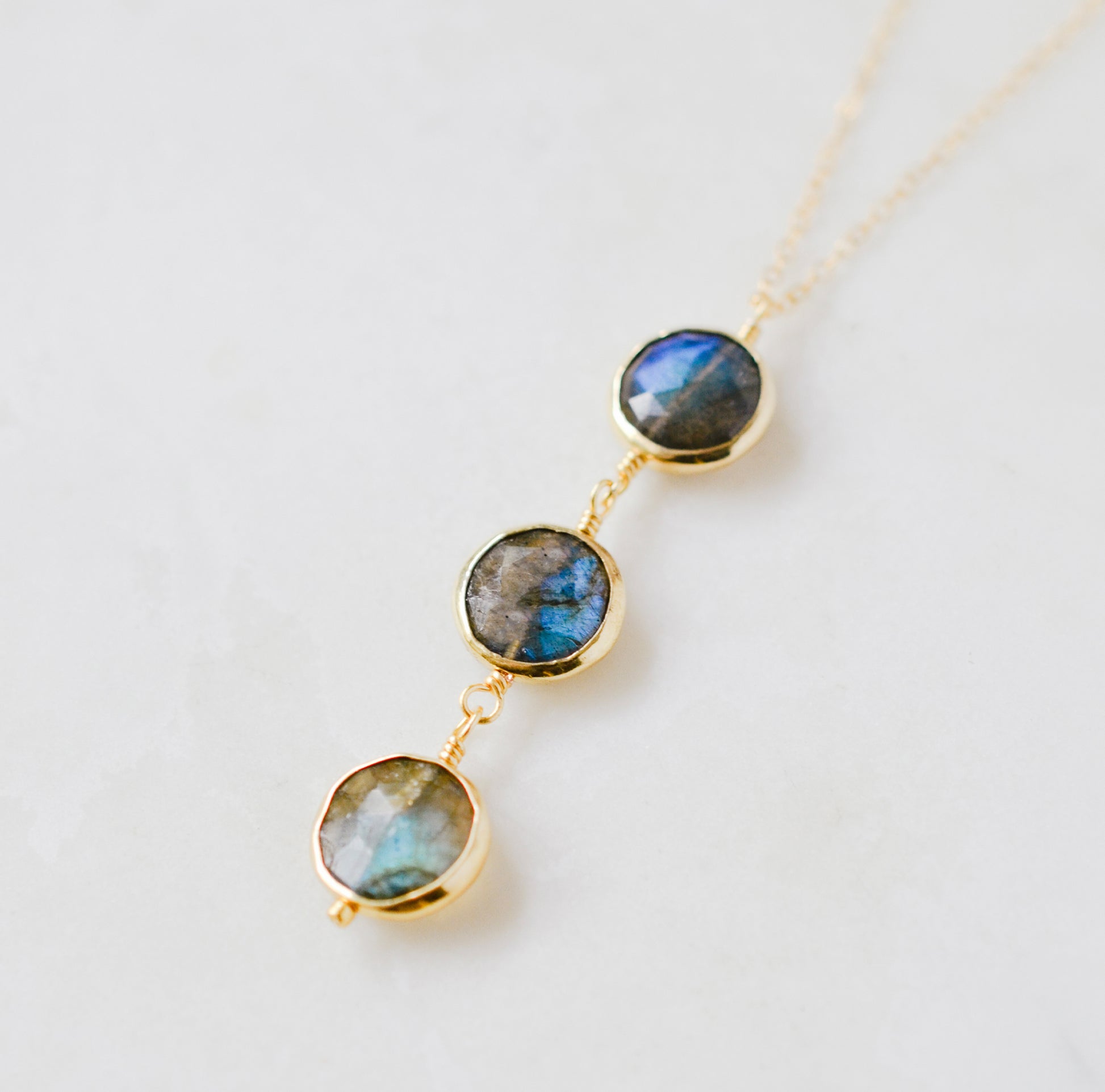 Necklace with three faceted genuine Labradorite stones on a 14k gold filled chain. This handcrafted artisan necklace is also available in sterling silver. Made in New England by Gemnia Jewelry.