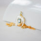 Handmade Maris necklace featuring a Blue Topaz set inside a clear Rock Crystal frame on a 14K Gold Filled chain. Ideal gift for wife, girlfriend, or mom. Minimalist topaz pendant for layering. Also a November birthstone.