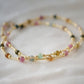 Multicolored, smooth polished Tourmaline gems hand-beaded with gold plated glass beads. Colors range from pink, green, brown, yellow, or black.