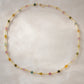 Multicolored, smooth polished Tourmaline gems hand-beaded with gold plated glass beads. Colors range from pink, green, brown, yellow, or black.