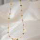 Multicolored, smooth polished Tourmaline gems hand-beaded with gold plated glass beads. Colors range from pink, green, brown, yellow, or black.