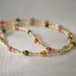 Multicolored, smooth polished Tourmaline gems hand-beaded with gold plated glass beads. Colors range from pink, green, brown, yellow, or black.