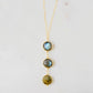 A handmade necklace with three natural Labradorite stones on a 14k gold filled chain.
