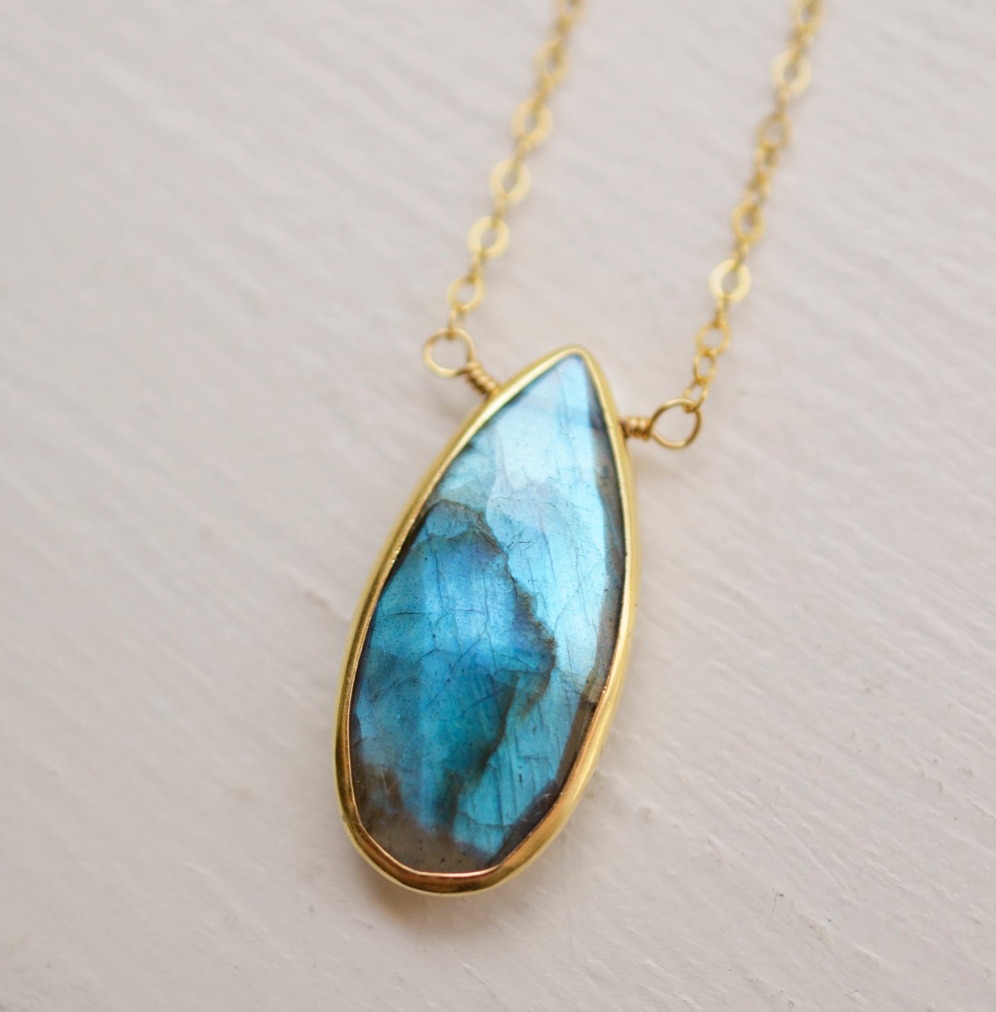 Labradorite Teardrop Necklace, Genuine labradorite bezeled in gold and suspended from a gold chain. Handmade by GEMNIA.