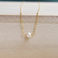 Single round white freshwater pearl necklace on a 14k gold filled chain.