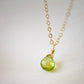 Natural green Peridot faceted teardrop suspended from a 14k gold filled cable chain.