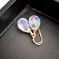 Rainbow colored mystic topaz earrings in 14k gold filled. The stone is a teardrop shape and shifts different rainbow colors..