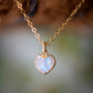 Natural rainbow moonstone heart pendant set onto a sterling silver or gold filled chain. Small stone heart pendant. 