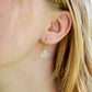 Mystic Topaz earrings modeled in 14k gold filled. The gemstone is a faceted heart briolette teardrop shape.