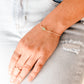 Pale green raw jade stone set onto a 14k gold filled chain.  Modeled image.